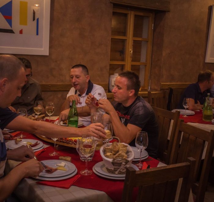 People enjoying eating traditional Croatian dished prepared for them in Drnis